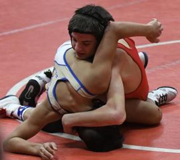 Sean McKay takes the upper hand in his 106-pound match Friday at the Medicine Valley Invitational.